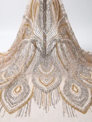 Gold & Silver Crystal Couture Beaded Fabric Ivory couture beaded fabric with gold and silver crystals, beads and large symmetrical statement motifs.