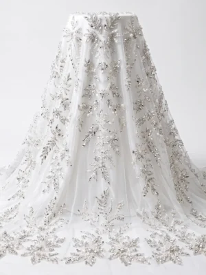 Ivory Crystal & Pearl Bridal Beaded Fabric Ivory bridal beaded fabric with silver crystals, pearls and hand embellished floral motifs on sheer tulle.