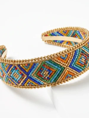 Multicolor Geometric Hand Beaded Headband Multicolor hand beaded headband with geometric seed bead patterns and metallic gold bead detailing.