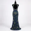 Navy blue peacock hand beaded back gown panel with green and gold feather motifs, open-back design and intricate couture beadwork.