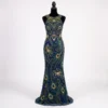 Navy blue peacock hand beaded front gown panel with green and gold feather motifs, floral beadwork and crystal embellishments for couture dresses.
