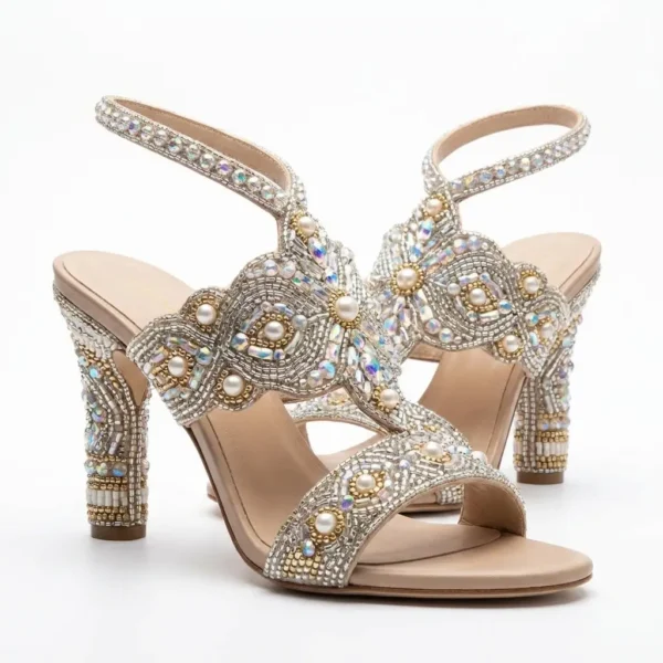 Pearl and crystal hand beaded block heel sandals with embellished straps and ankle fastening.