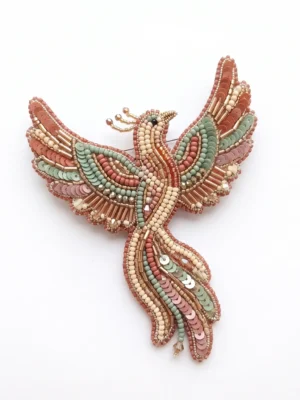 Phoenix bird hand beaded brooch with blush pink, sage green and ivory seed beads, sequins, metallic bugle beads and crystal accents.